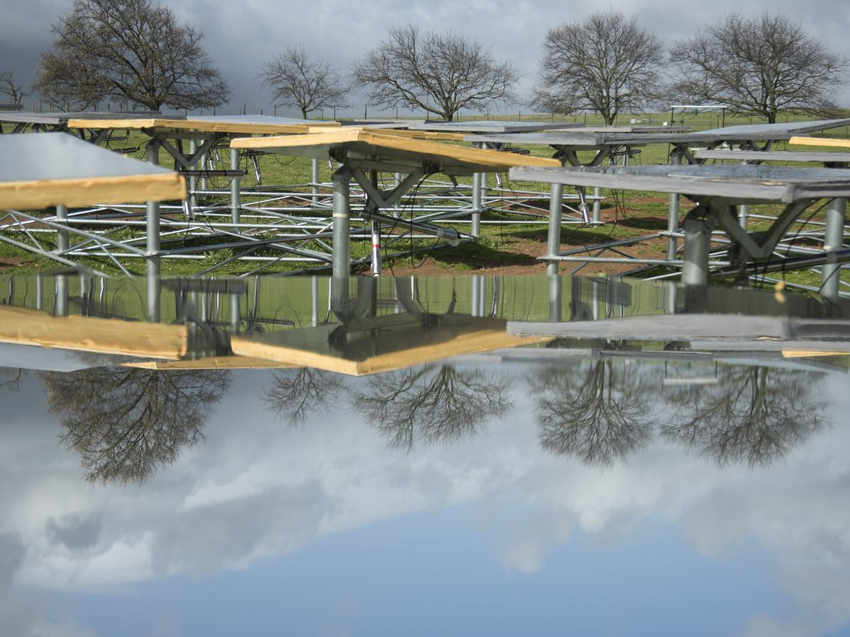 Solar installation reflected in standing water in South Africa